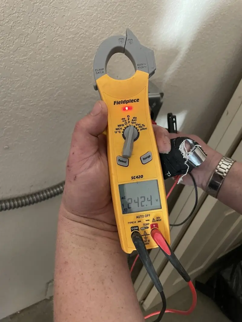 Voltage testing with clamp meter during Ceiling Fan Installation in Peach Bottom
